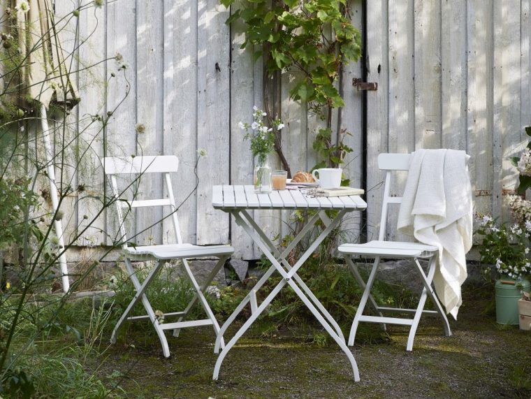 A Garden With A White Small Foldable Table And Two Chairs … avec Ikea Table Pliante Jardin